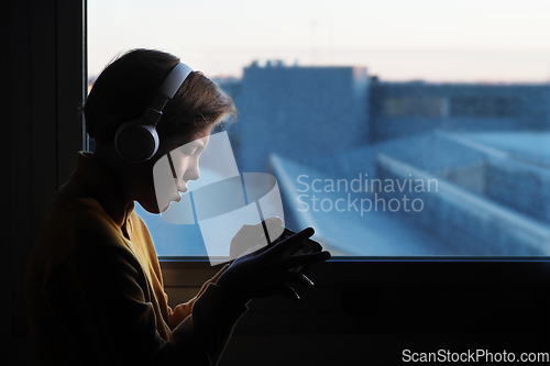 Image of Teenage boy in white headphones