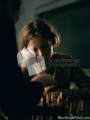 Image of Teenager 12 years old plays chess