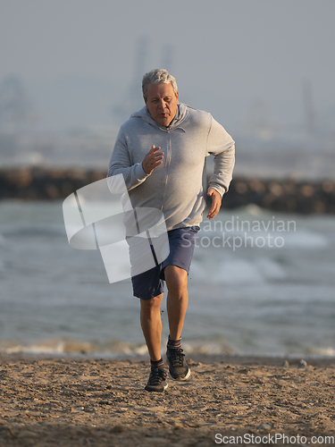 Image of An elderly man is running