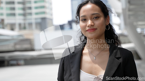 Image of Young Businesswoman in the City