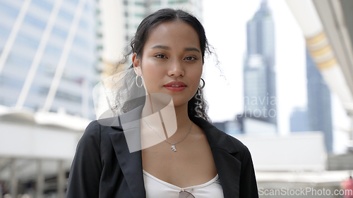 Image of Young Thai Businesswoman in an Urban District