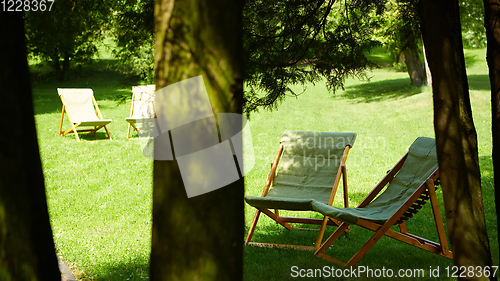 Image of Rest chairs in the garden. Resort concept