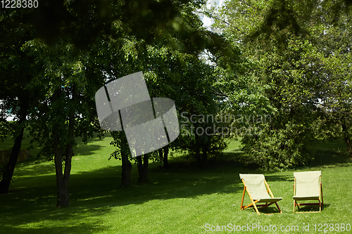 Image of Rest chairs in the garden. Resort concept