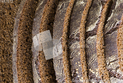 Image of black rye bread cut