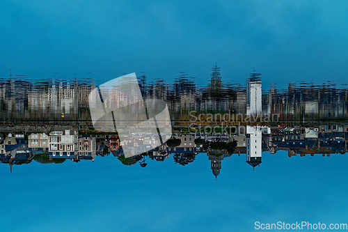 Image of Original inverted photo with the reflection of the ancient city in the water