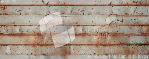 Image of old rusty sheet metal wall banner