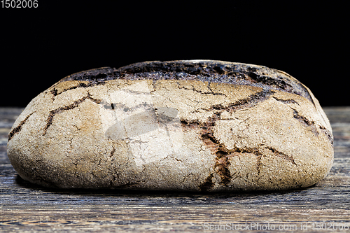 Image of black homemade rye flour bread