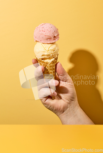 Image of ice cream in human hand