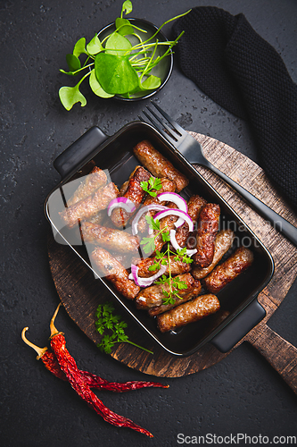 Image of Traditional south european skinless sausages cevapcici made of ground meat and spices