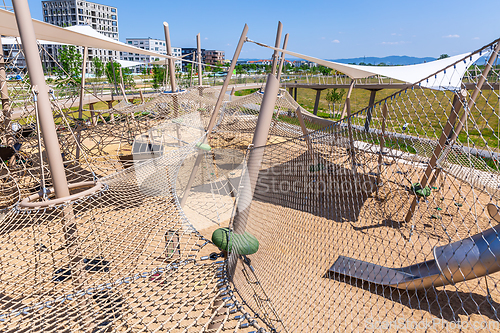 Image of Modern wooden playground for children and kids in suburb, concept of modern urban living