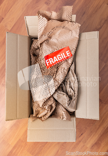 Image of Delivery and mail service, people and shipment concept - fragile mark in parcel box