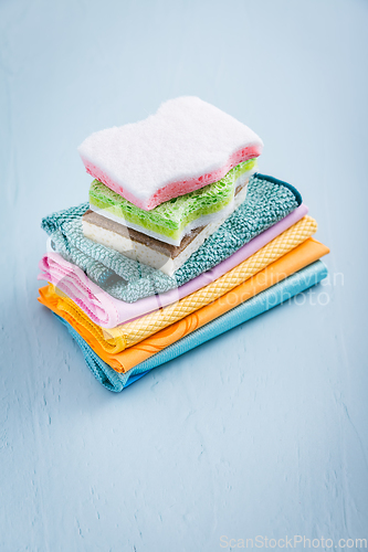 Image of Assortment of different sponges and cleaning rags, with fiber cloth and duster microfiber cloth