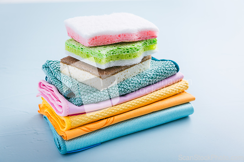 Image of Assortment of different sponges and cleaning rags, with fiber cloth and duster microfiber cloth