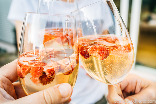 Image of Summer strawberry wine cocktail, toasting with refreshing drinks