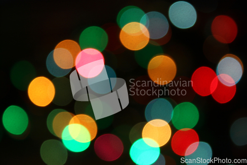 Image of Colorful festive blurry lights of Christmas decorations