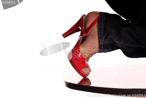 Image of jeans foot red highheel