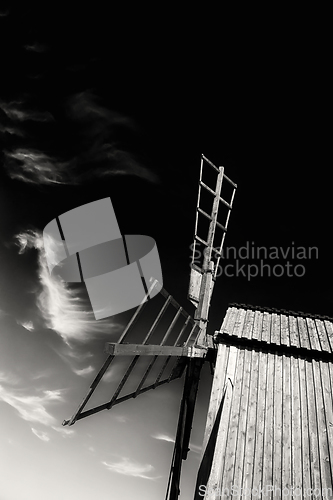 Image of Windmill under dramatic sky