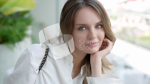 Image of Elegant Caucasian Woman with Positive Smile Looking at Camera