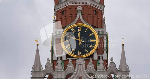 Image of Moscow Kremlin Main Clock named Kuranti on Spasskaya Tower 12 hours . Red Square.