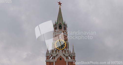 Image of Moscow Kremlin Main Clock named Kuranti on Spasskaya Tower 12 hours . Red Square.