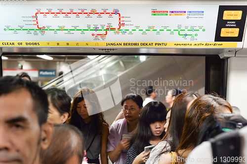 Image of Passengers boarding metro train, Singapore