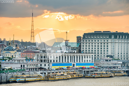 Image of Kyiv skyline with embankment at sunset