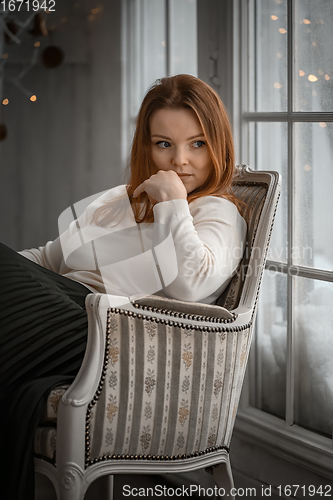 Image of Beauty portrait of finnish scandinavian type caucasian woman sitting on chair