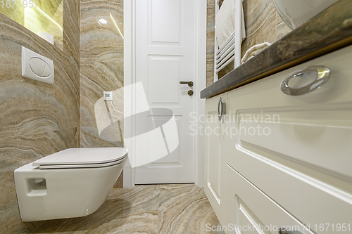 Image of Luxury bathroom with beige marble tiles