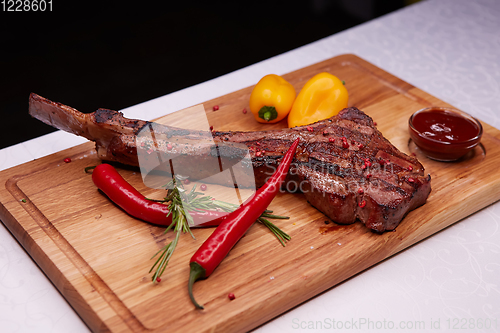 Image of The Barbecue Tomahawk Steak on Cutting Board