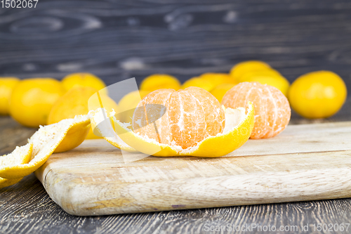 Image of peeled orange juicy tangerine