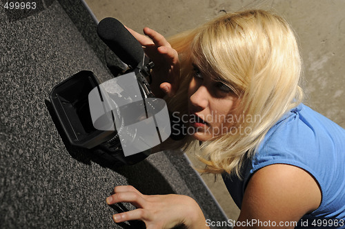 Image of young woman video camera