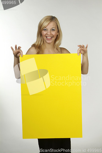 Image of blond woman yellow sign