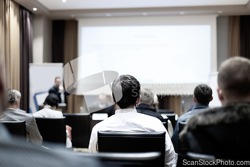 Image of Male speeker having talk at public event.