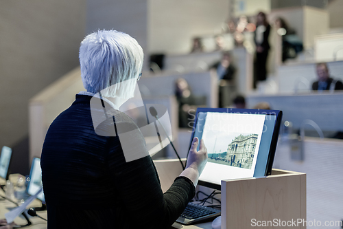 Image of Business woman lecturing at Conference.