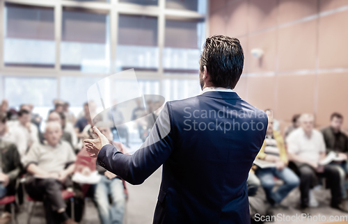 Image of Speaker at Business Conference and Presentation.