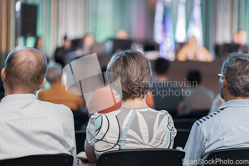 Image of Speaker Giving a Talk at Business Meeting. Audience in the conference hall. Business and Entrepreneurship