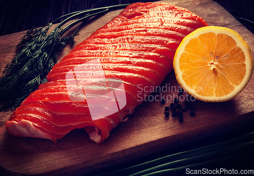 Image of Fresh salmon piece on wooden board