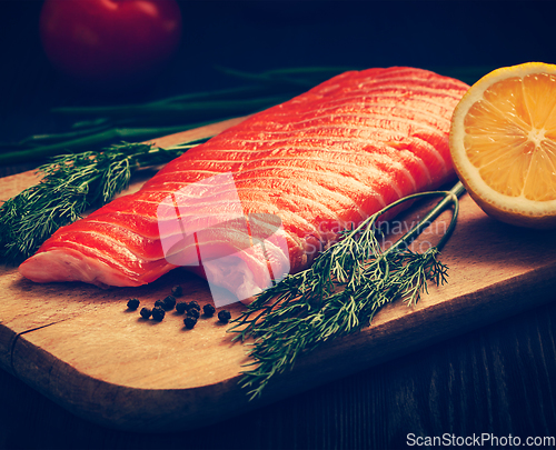 Image of Fresh salmon piece on wooden board