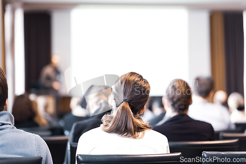 Image of Speaker at Business Conference and Presentation. Audience in the conference hall. Business and Entrepreneurship. Copy space on white screen