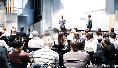 Image of Business speaker giving a talk at business conference event.