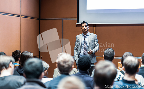 Image of Business speaker giving a talk at business conference meeting event.