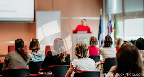 Image of Woman giving presentation on business conference event.