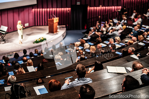 Image of Woman giving presentation on business conference event.