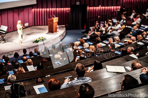 Image of Woman giving presentation on business conference event.