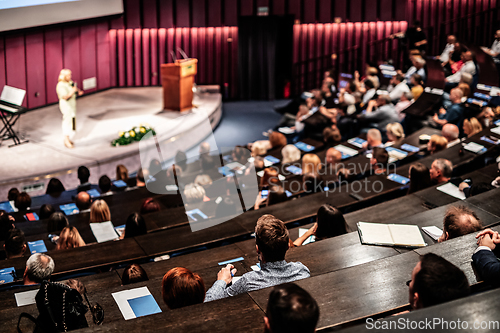 Image of Woman giving presentation on business conference event.