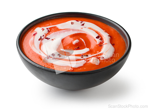 Image of tomato cream soup on white background