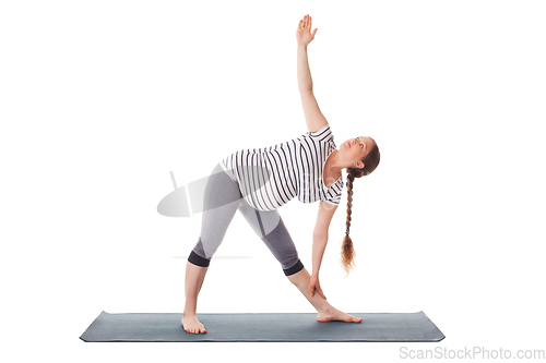 Image of Pregnant woman doing yoga asana Utthita trikonasana