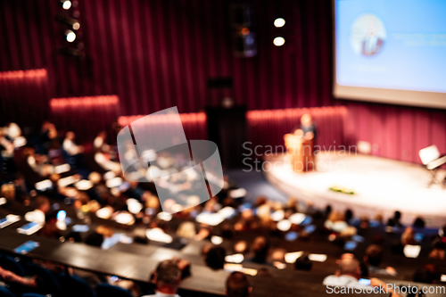 Image of Woman giving presentation on business conference event.