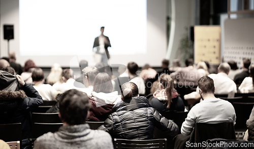 Image of Business speaker giving a talk at business conference event.