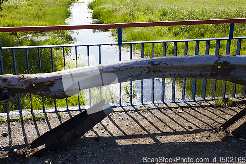 Image of old metal barrier after the accident